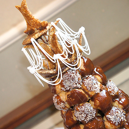 Croquembouche top decorated with nougatine and piped royal icing