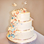 Navy and burgundy butterfly and flower wedding cake