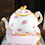 Carved cake teapot with handpainted roses